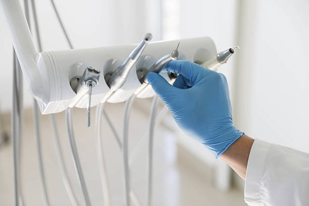 Professional Tooth Extraction technician working in St. Charles, MI